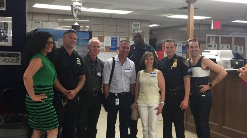 Greenwich Village-Chelsea Chamber of Commerce members posing for a photo with Sixth Precinct officers, including Maria Diaz, G.V.C.C. executive director, at far left; Ken Russo, fourth from left; Rocio Sanz, third from right; and Mathew Heggem, far right.